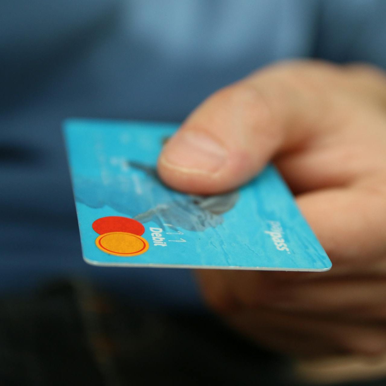 Person Holding Debit Card